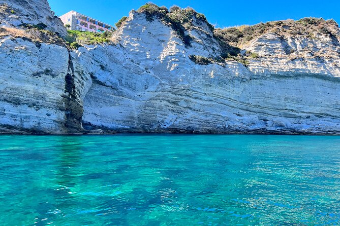 Boat Tour to Procida and Ischia, discover Private Secret Beaches - Corricella at golden hour: steps-only fishermen port and gelato stop
