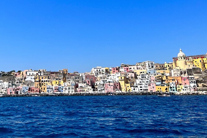 Boat Tour to Procida and Ischia, discover Private Secret Beaches - Procida’s rocky lookouts: Punta di Pioppeto and the lighthouse vibe