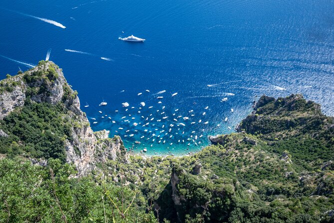 From Naples: Blue Grotto & Faraglioni iconic sights Guided Tour - Capri town: the fashionable streets and a quick dose of free wandering