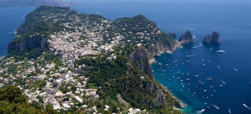 From Naples: Complete Capri Guided Boat and Bus Tour - Capri town and Augustus Gardens: Faraglioni views without the maze