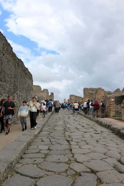 From Naples: Pompeii and Vesuvius Tour with Lunch Included - Mount Vesuvius crater time: views, geology, and safety rules