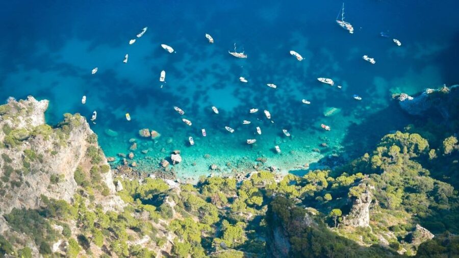Naples: Capri Transfer with Island Boat Tour and Free Time - The Guided Capri Boat Tour: Faraglioni, Caves, and Blue Grotto Pass-By Views