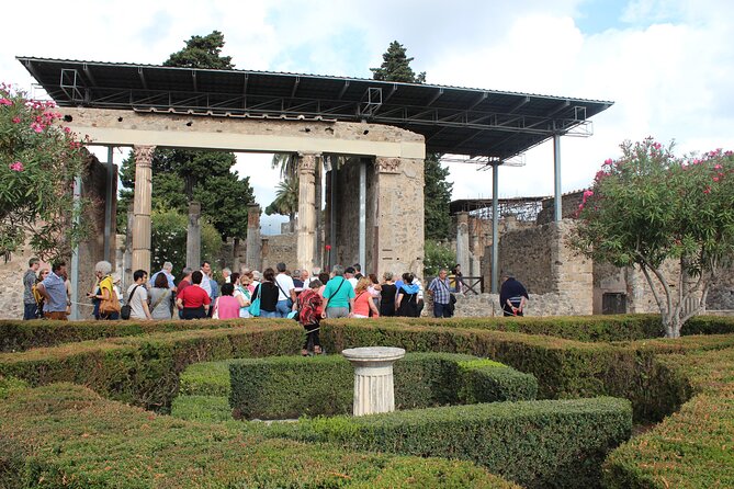 Pompeii Skip-the-Line Tour – Private and limited group options - Ercolano Door and the 79 AD snapshot you can read on the ground