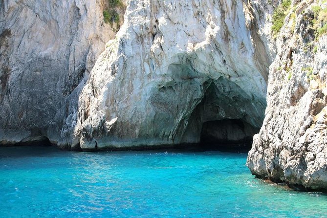 Private Full-Day Capri and Blue Grotto Stress Free Tour from Rome - Blue Grotto by rowboat: the low-ceiling entrance and the color show